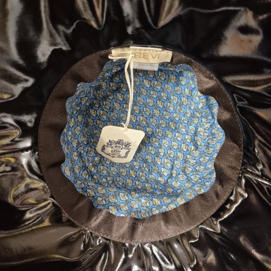 Wide-brimmed rain hat by Grévi